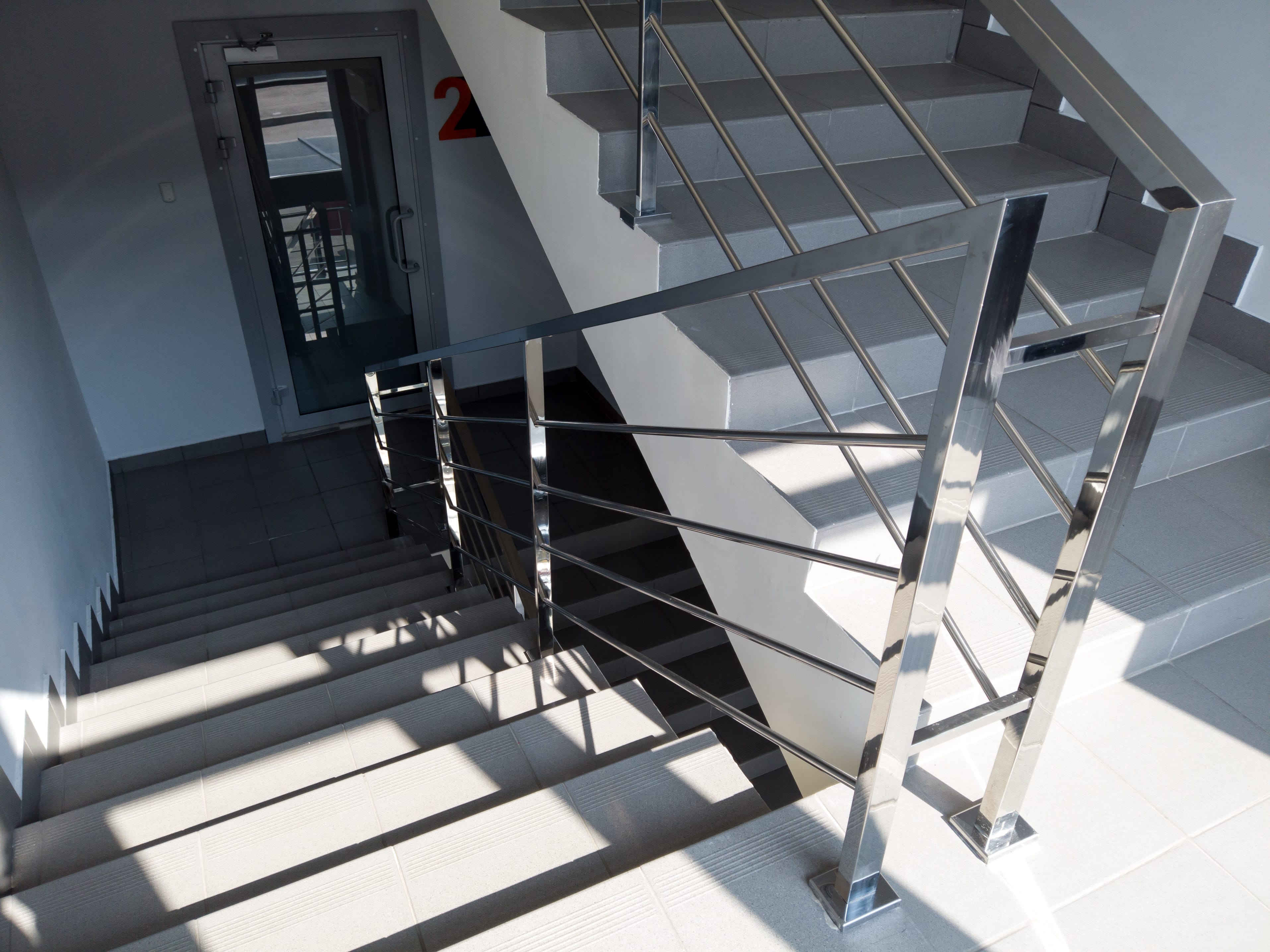 modern,stairs,with,metal,railing,in,office,building.,staircase,with