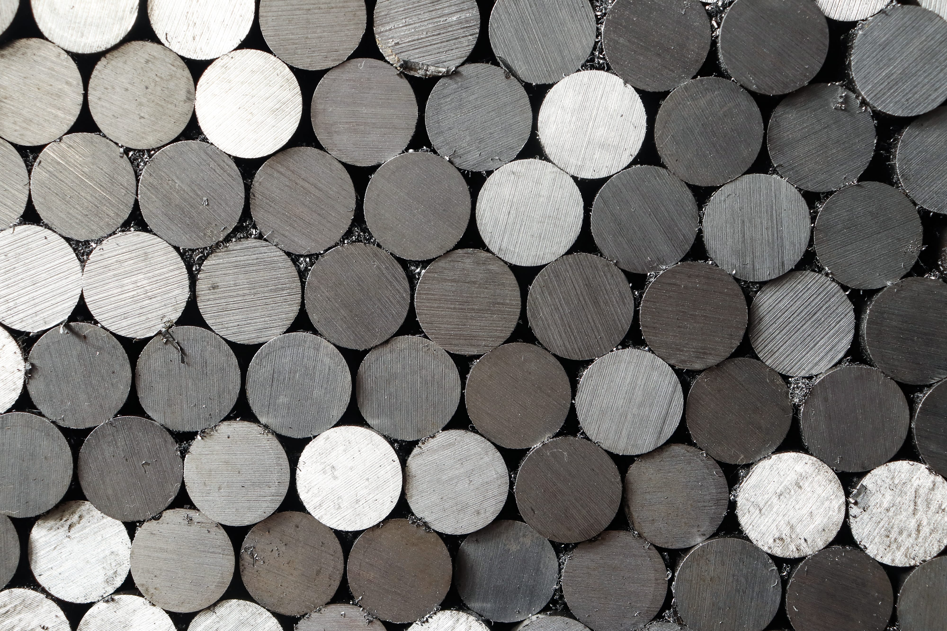 a,thick,steel,bar,cut,on,a,band,saw,at