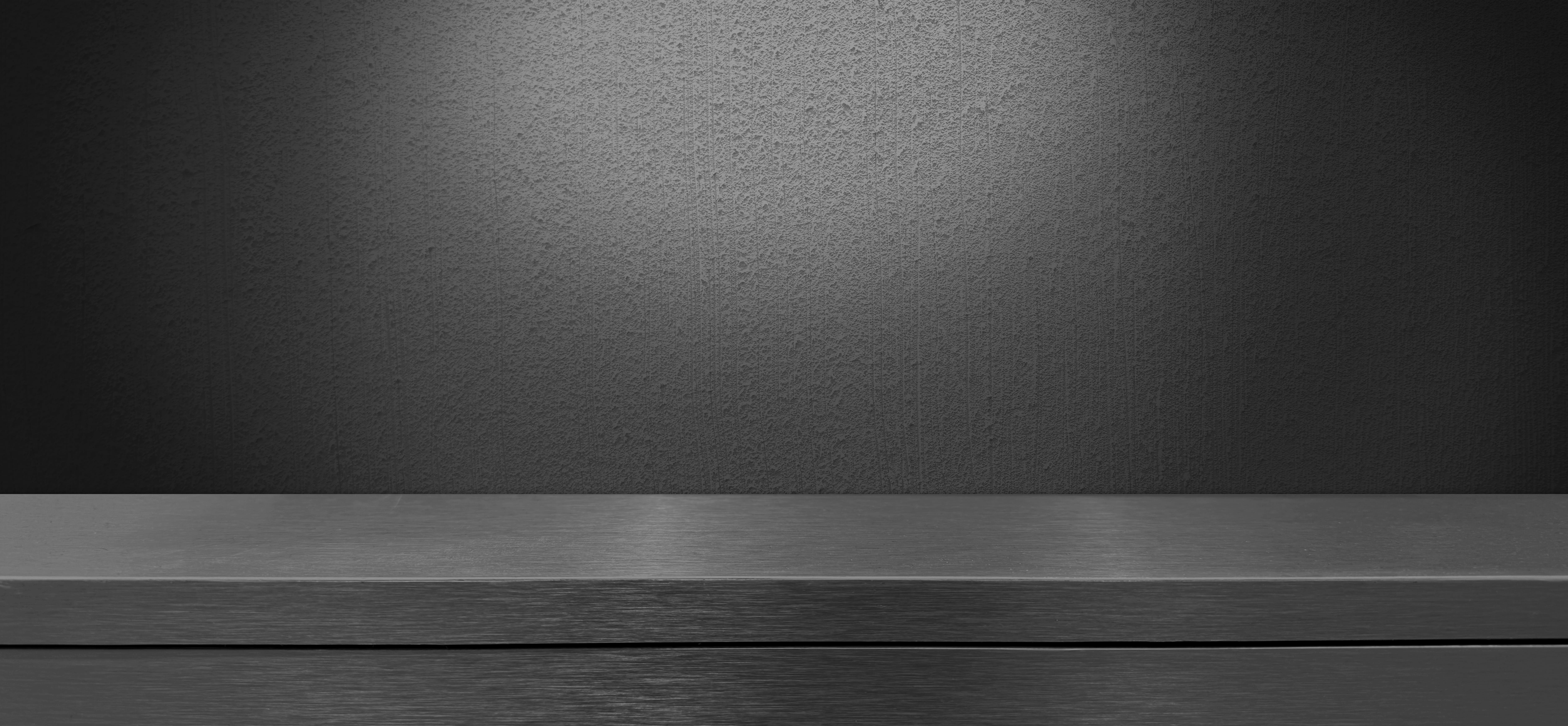 dark,black,brushed,stainless,steel,counter,or,table,at,foreground